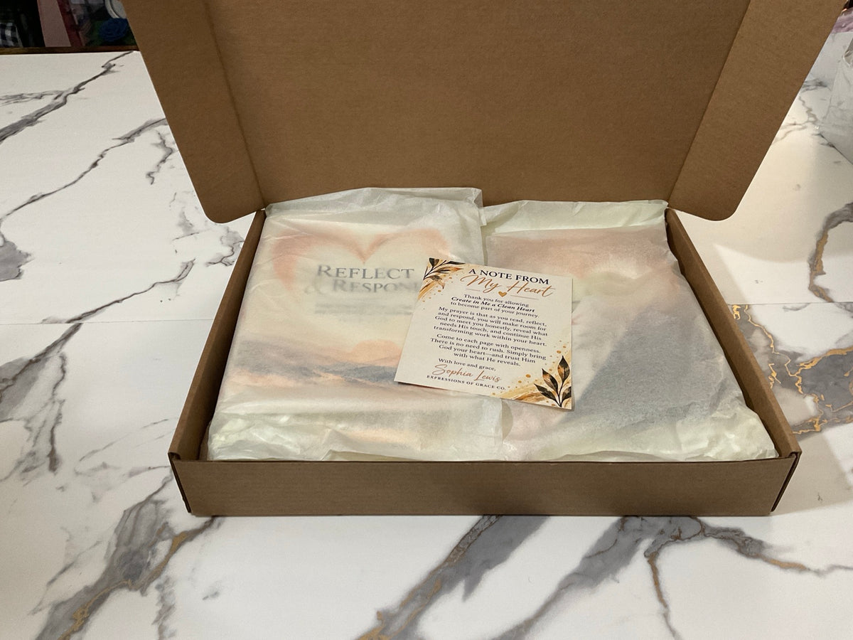 Gift set nestled under ivory tissue with handwritten-style personal card