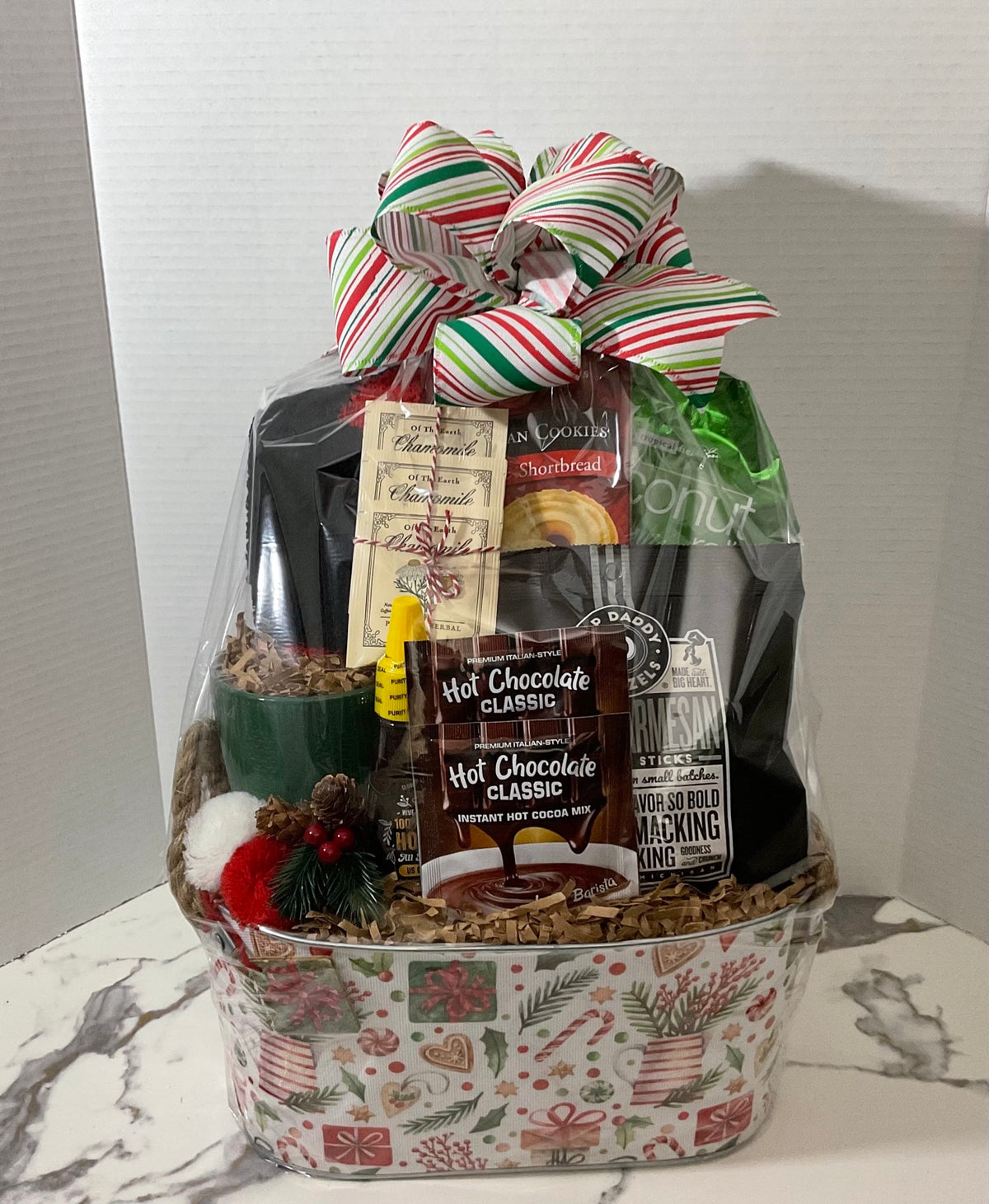 Holiday Comfort Gift in festive Christmas motif container with striped bow